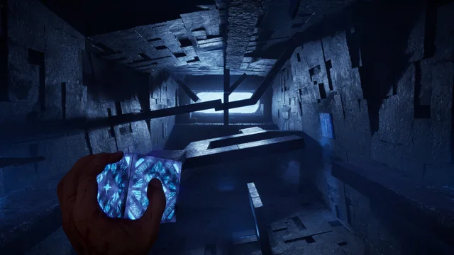 A glowing blue puzzle box facing a broken stone staircase inside the Labyrinth of Clive Barker's Hellraiser: Revival.